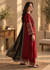 Khizra Artstyle crimson embroidered 3-piece suit — Garnet Grace design, side profile with the black embroidered dupatta draped over one arm