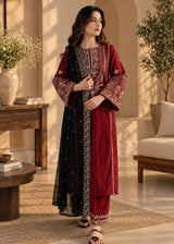 Khizra Artstyle crimson embroidered 3-piece suit — Garnet Grace design, standing three-quarter view with the dupatta layered over the shoulder