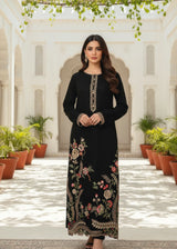 Khizra Artstyle black embroidered 2-piece suit — Hina design, full front portrait under hanging vines in a courtyard